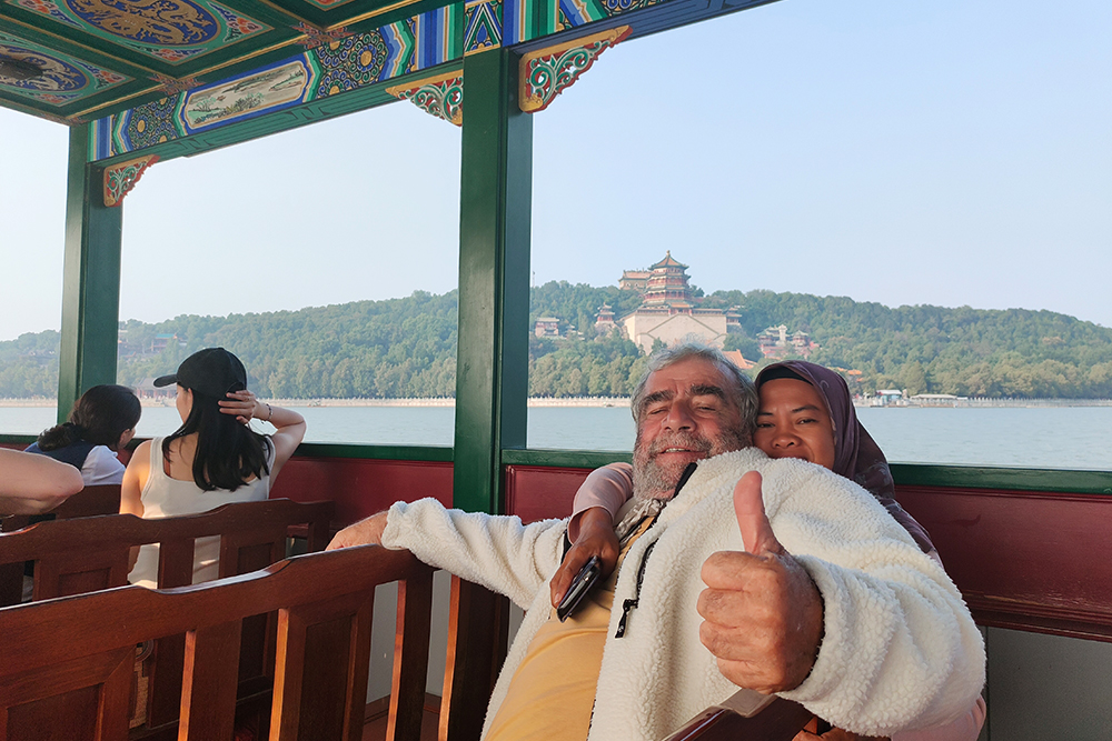 Tour 4 ,  Summer Palace . Olympic Center . Lamah Buddiest Temple . Ride Rickshaw visit Hutong with a local family . Yandaixiejie Hutong and Houhai lake .